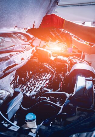 Repairing engine at service station. Car repair.の写真素材