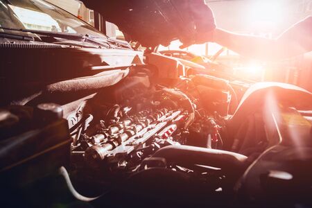 Repairing engine at service station. Car repair.の写真素材