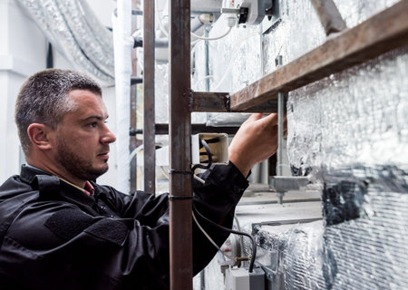 Ventilation cleaning. Specialist at work. Repair ventilation system