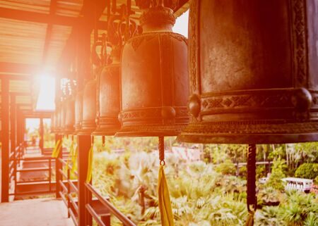 Symbols of Buddhism. Bells. South-Eastern Asia. Details of buddhist templeの写真素材