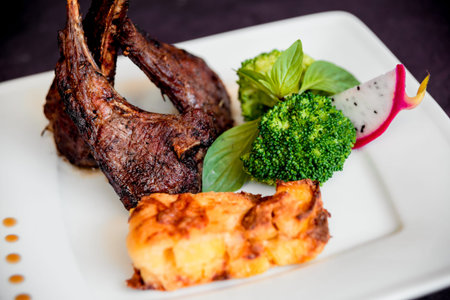 Roasted meat on the white plate. Barbecue. Restaurant.