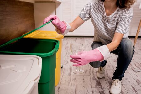 Young girl sorting garbage at the kitchen. Concept of recycling. Zero wasteの写真素材