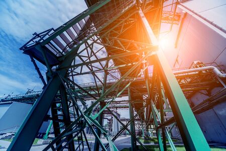 Equipment and pipeline in oil refinery. Industrial background with clear skyの写真素材