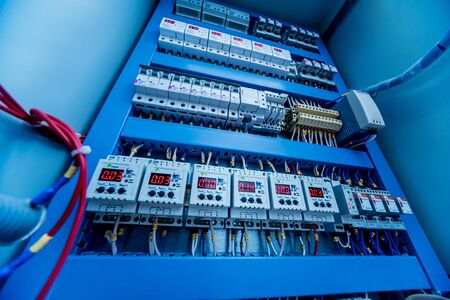 Voltage switchboard with circuit breakers. Electrical background.の写真素材