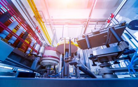 Automatic labeling machine during operation. Factory for the production of vegetable oil. Industry backgroundの写真素材