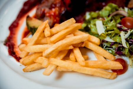 Grilled meat on the white plate. Restaurantの写真素材