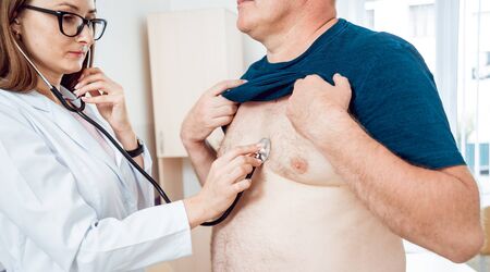 Doctor cardiologist with patient in the hospital. Diagnostic.の写真素材
