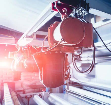 Modern automated production line in factory. Plastic bag manufacturing process. Background