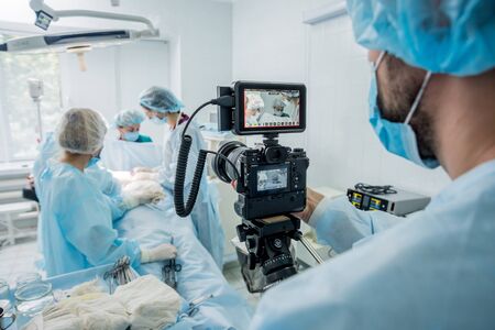The videographer shoot the surgeon and assistants in the operating room with surgical equipment. Medical backgroundの写真素材