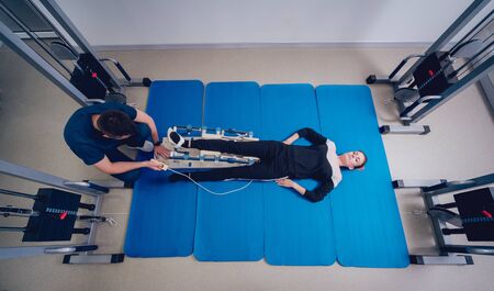 Patient on CPM machines. Continuous passive range of motion.の写真素材