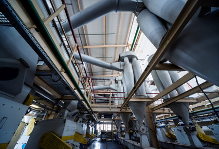 Interior of modern natural oil factory. The piping, pumps and motors. Industry background