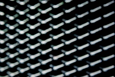 Abstract metal grid background. Lattice texture with big cells grid. Selective focusの写真素材