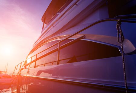 View of harbor with yachts details. Beautiful sunset sky in the marina bay. Backgroundの写真素材