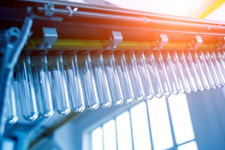 The plastic bottle blowing machine. PET preforms for blowing of plastic bottles. Heating process. High technologyの写真素材