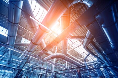 Air conditioning of buildings. Background of ventilation pipes. Laying of engineering networks. Industrial backgroundの写真素材