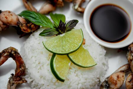 Lemon and rice on the white plate. Restaurantの写真素材