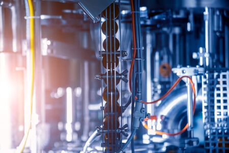Bottling line of sunflower oil in bottles. Vegetable oil production plant.の写真素材
