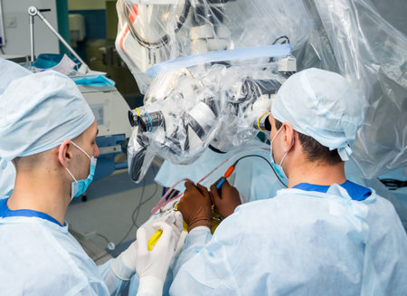 Brain surgery. Group of surgeons in operating room with surgery equipment. Modern medical background
