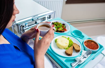Tray with breakfast for the young female patient.の写真素材