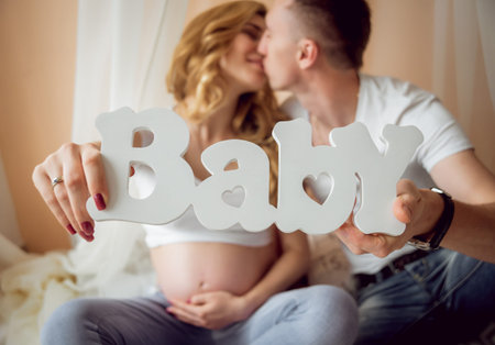 Young pregnant woman and her husband. Waiting for baby.