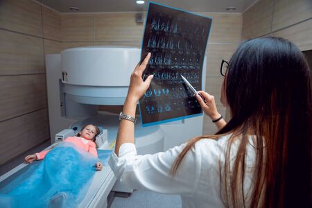 Medical equipment. Doctor and patient in MRI roomの写真素材