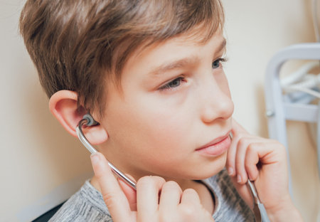 Treatment and warming-up the ears of a young boy.