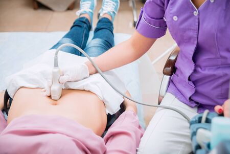 Ultrasound scanner in the hands of a doctor. Diagnostics. Sonography.の写真素材