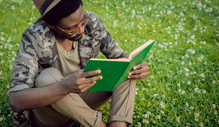 African student in the park. Beautiful background