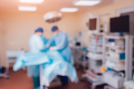 Group of surgeons in operating room with surgery equipment. Background