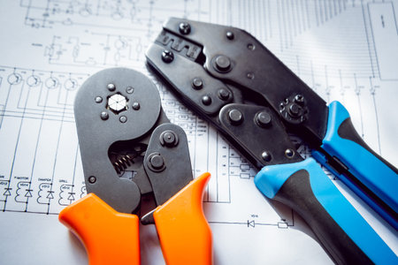 Electrical equipment. Electricity cable and crimper. Background and texture