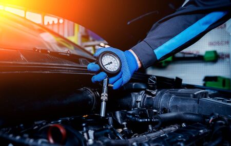 Repairing engine at service station. Car repair.の写真素材