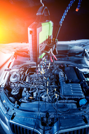 Service station. Car repair wiring. Engine view.