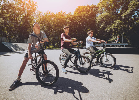 Bmx rider performing tricks at skatepark. Background.