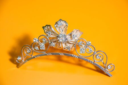 Crown on the yellow tableの写真素材