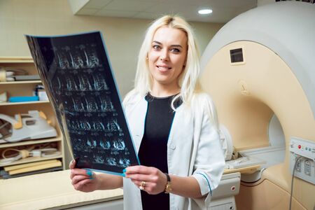 Medical equipment. Doctor in MRI room at hospitalの写真素材