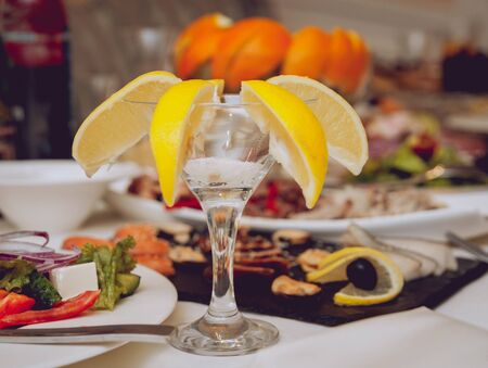 Restaurant table with plates salad, meat and vegetables. Food backgroundの写真素材