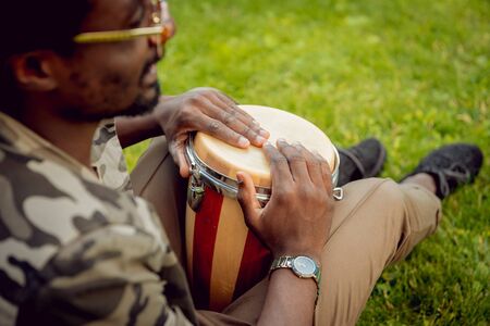 African student in the park. Beautiful backgroundの写真素材
