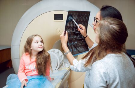 Medical equipment. Doctor and patient in MRI roomの写真素材