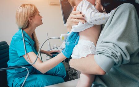 Doctor and little boy patient. Ultrasound equipment.の写真素材