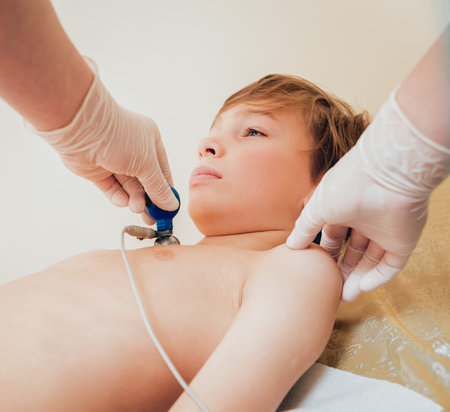 Doctor with electrocardiogram equipment making cardiogram test