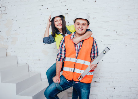 Happy couple making repairs to their home.
