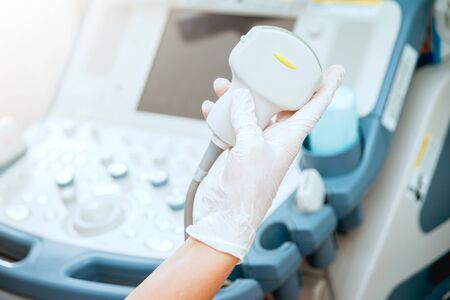 Ultrasound scanner in the hands of a doctor. Diagnostics. Sonographyの写真素材