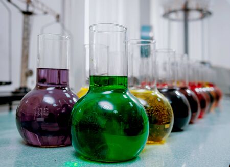 Laboratory glassware with colored liquid. Medical backgroundの写真素材