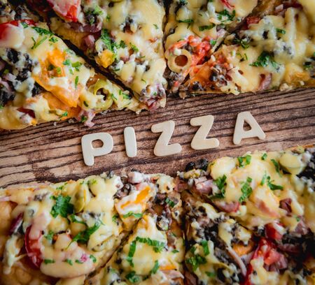 Large pizza on a wooden table. Restaurantの写真素材