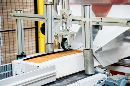 Production line of the wooden floor factory. CNC automatic woodworking machine.の写真素材