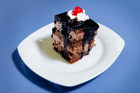 Cake on the blue table. Isolated