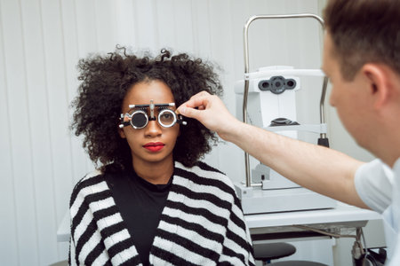 Consultation with an ophthalmologist. Medical equipment. Light background.