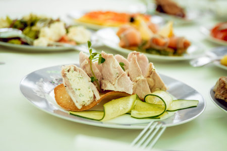 Restaurant table with plates salad, meat and vegetables. Food background
