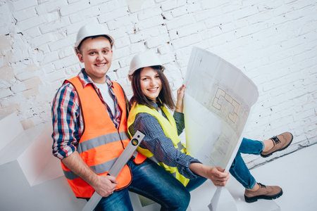 Happy couple making repairs to their home.