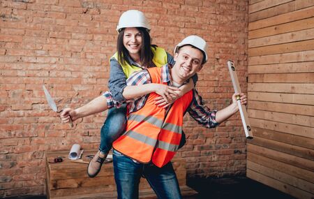 Happy couple making repairs to their home.の写真素材